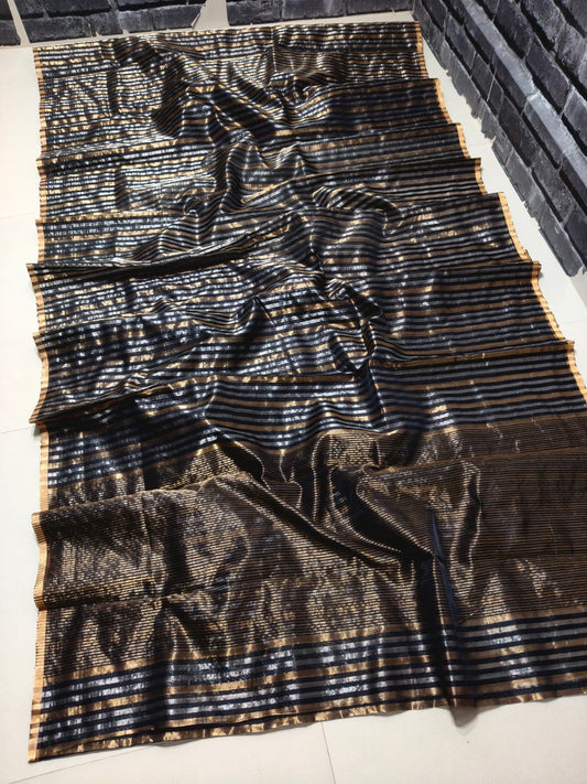 Silver-gold pinstripe pattern deepening toward gold near pallu, black Pattu Silk Chanderi saree