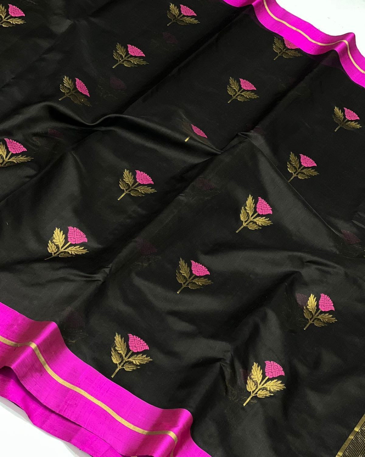 Black handloom Pattu Silk Chanderi saree with fuchsia pink floral buttas and a fuchsia border