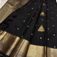 Black handwoven Kanchipuram silk saree with antique-gold zari and broad traditional border.