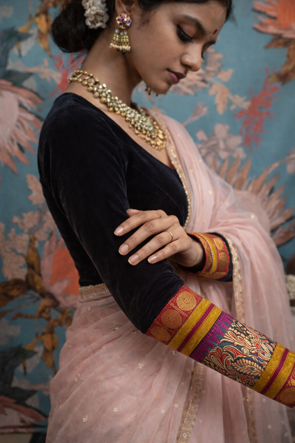 Model wearing black velvet patchwork blouse with Banarasi kimkhwab silk sleeves and zari weaving — Idam Living