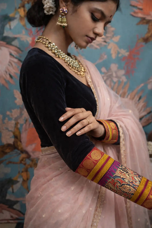 Black velvet saree blouse with Banarasi Kimkhwab silk sleeves by Idam Living
