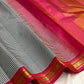 Draped Pure Silk Kanchipuram showing micro checks and warm gold zari against deep pink