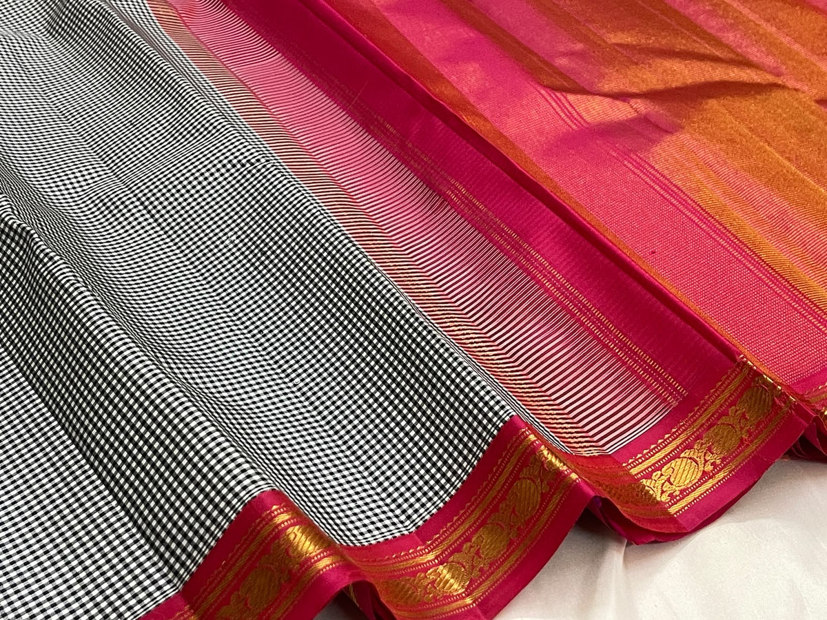 Draped Pure Silk Kanchipuram showing micro checks and warm gold zari against deep pink