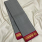 Handwoven Podi Kattam Kanchipuram showing tiny black and white checks and paisley zari border