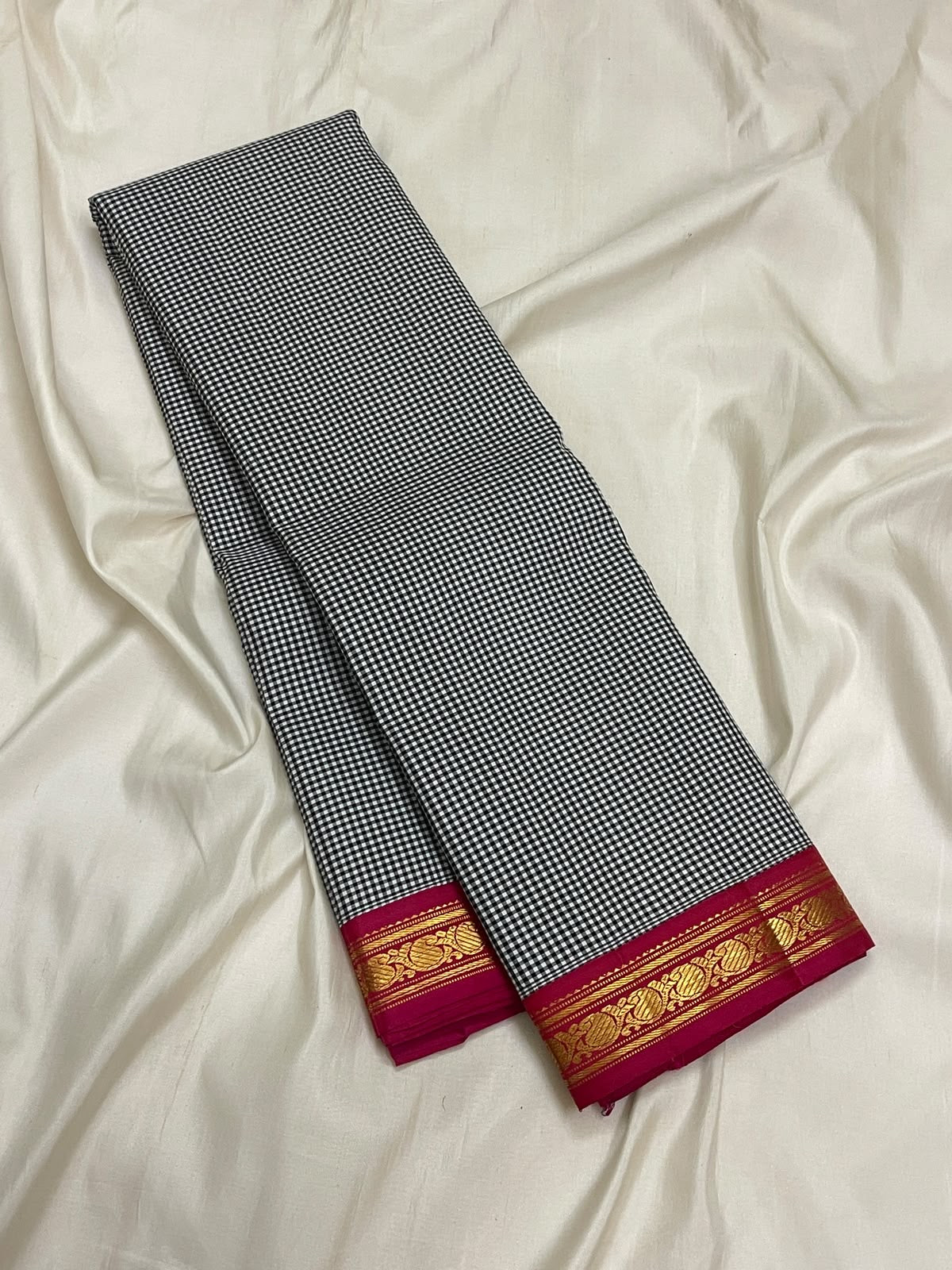 Handwoven Podi Kattam Kanchipuram showing tiny black and white checks and paisley zari border