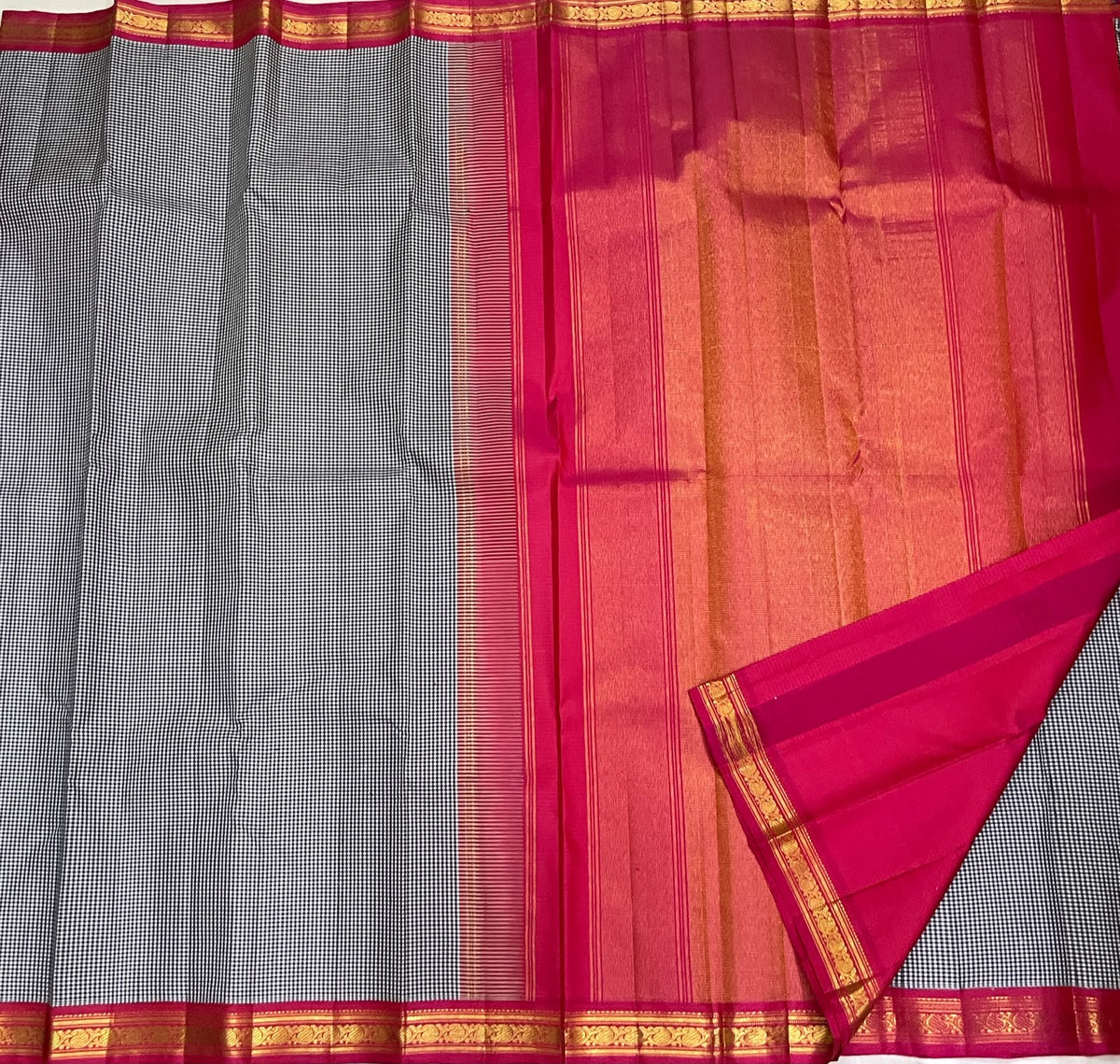 Vintage-style black and white checked Kanchipuram silk with saturated pink contrast border
