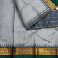 Black and white miniature checks forming a grey body on handwoven Kanjivaram silk