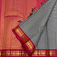 Fine black and white checked Kanchi Kattam silk body beside deep pink and gold zari border