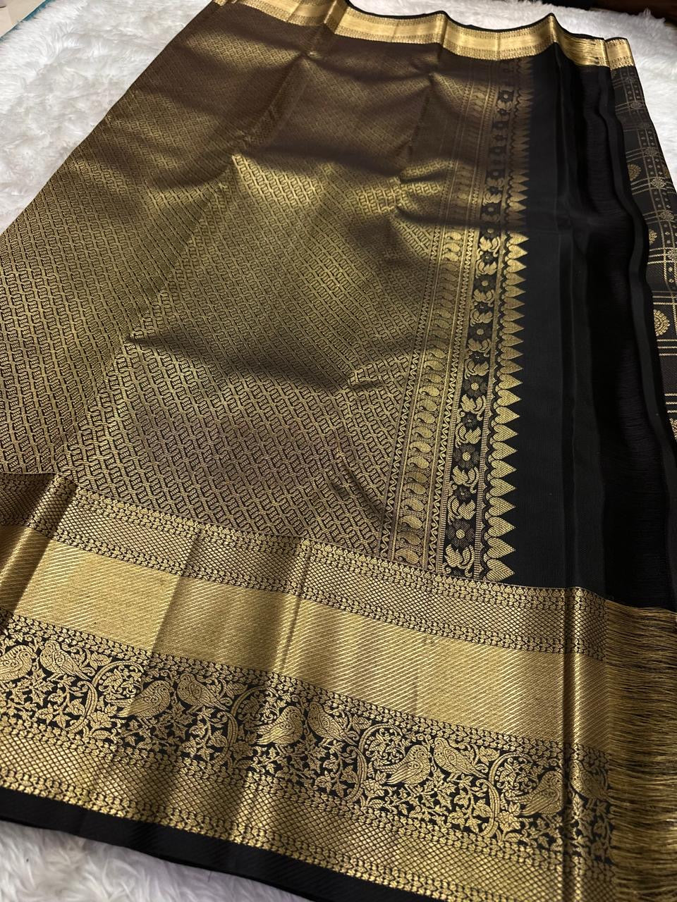 Raven Black Handwoven Pure Silk Kanjeevaram Saree with Zari Kattam and Antique Gold Peacock Border