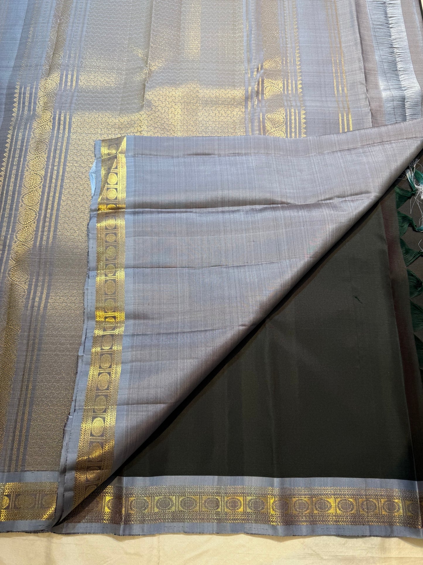 Full charcoal black Kanjipuram Korvai saree folded view