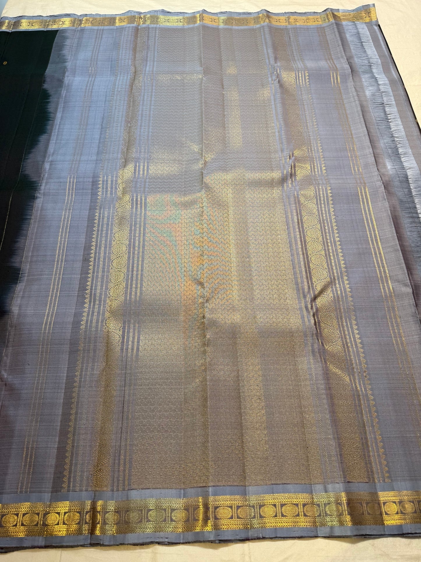 Grey pavun motif pallu detail on charcoal black saree
