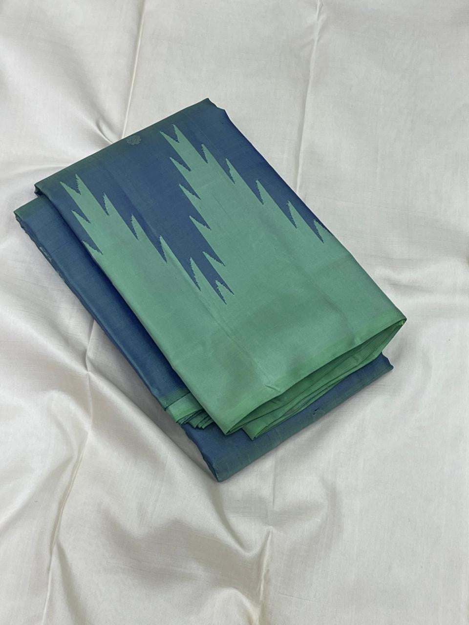 Folded Pure Kanchipuram silk saree in mint and deep blue with bold thazampoo reku contrast pattern