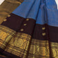 Close view of antique-gold zari butta on Azure Blue Kanjivaram silk.