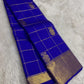 Royal Blue Pure Silk Kanchipuram saree with antique gold Zari Kattam checks, handwoven Gandaberunda motifs and broad zari border.