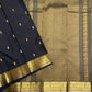 Close-up of the midnight black Kanchipuram silk saree border with intricate paisley detailing and structured antique gold zari bands.