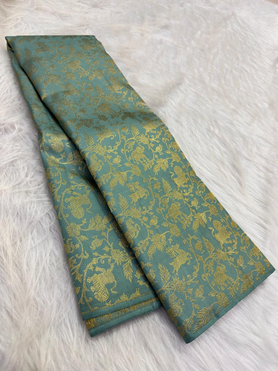 Peacock and floral gold zari detail, aqua Kancheepuram Vanasringaram saree