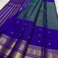 Close view of antique-gold zari butta on Mayil Kazhuthu blue-green Kanjivaram silk.