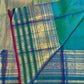 Iridescent peacock-neck blue and green pure silk Kanchipuram saree, petite peacock zari buttas blue green; traditional Varisaipet weave.