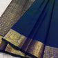 Close view of handwoven warm-gold zari paisley buttas on Mayil Kazhuthu pure silk
