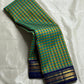 Blue-green Kanjeevaram saree body showing uniform pattani kattam check weave — detail view