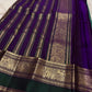Mayil Kazhuthu Green Kanjivaram saree with ornate Royal Purple Yanai motif border