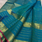 Blue-green pure mulberry silk Varisaipet saree with fine gold lines and Rani Pink selvedge.