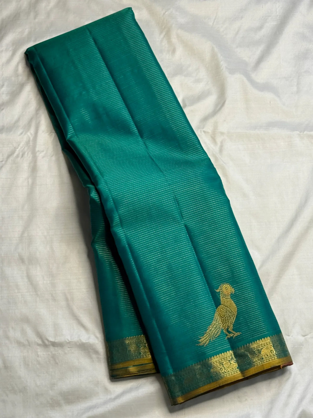 Blue-green pure silk Vairaoosi saree with finely woven antique-gold ornamental border.