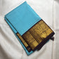 Close-up of black silk checks on the robin's egg blue Kanchi Kattam saree body