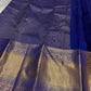 Full spread of royal blue pure Kanchipuram silk saree with gold zari woven pallu and border, flat lay detail
