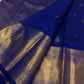 Close view of royal blue saree with gold zari woven body, pallu texture, and wide border detailing