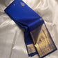 Royal blue pure Kanchipuram silk saree folded to show gold zari border and pallu panel on a light background