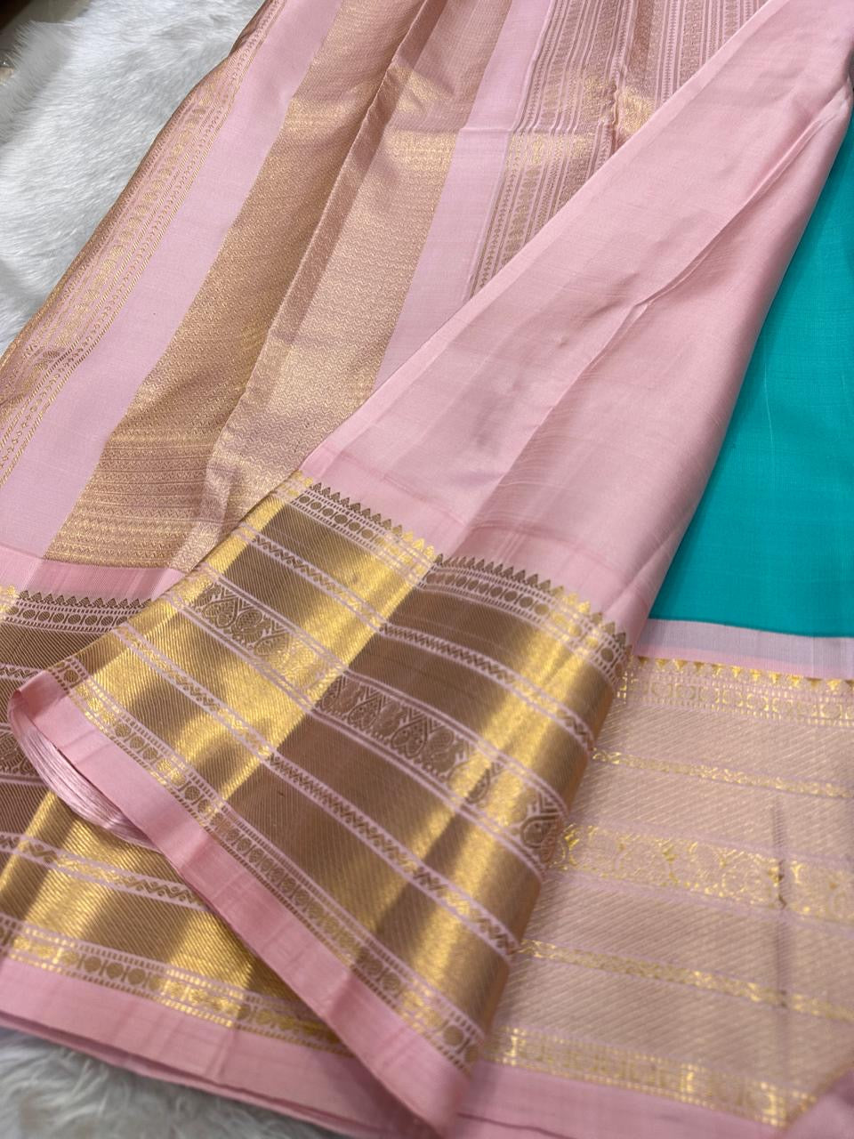 traditional tested zari detail on turquoise blue Kanchipuram silk saree