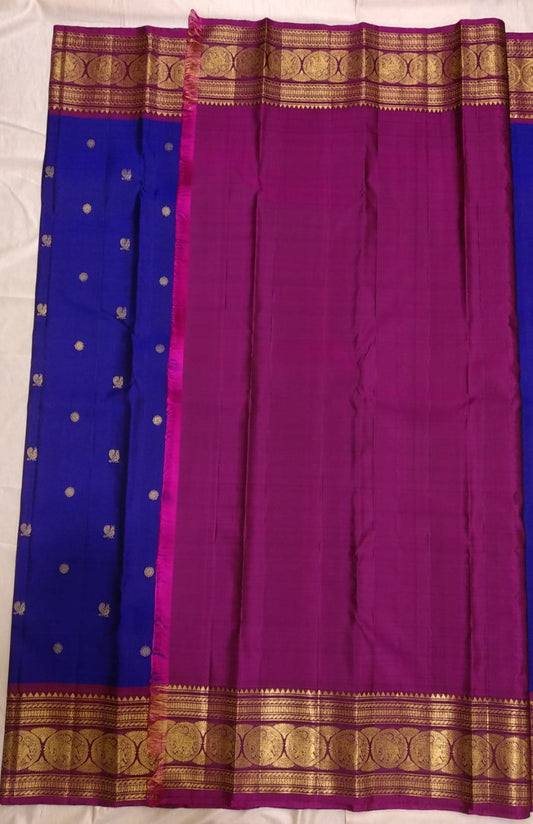 Cobalt blue Kanjivaram saree with small gold motifs and plum zari border detail