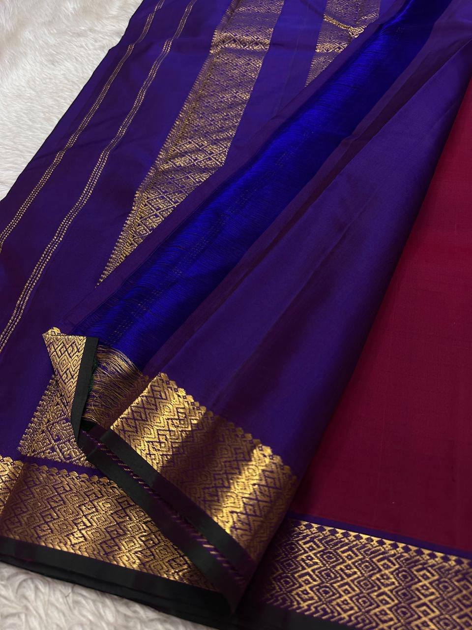 Close view of royal blue pallu on a Pure Kanchipuram silk saree with zari woven panels and fine vertical stripe detailing.