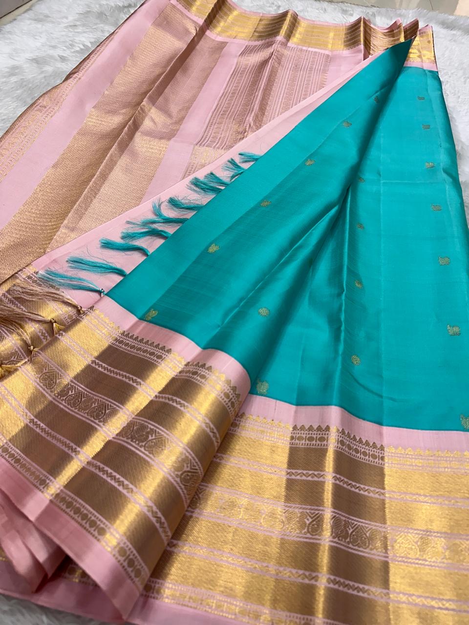 Kanjeevaram silk saree in lagoon blue with blush pink border Korvai weave pallu detail