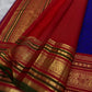 Pillar-box red and olive-green peacock border, royal-blue Kanchi Pattu saree