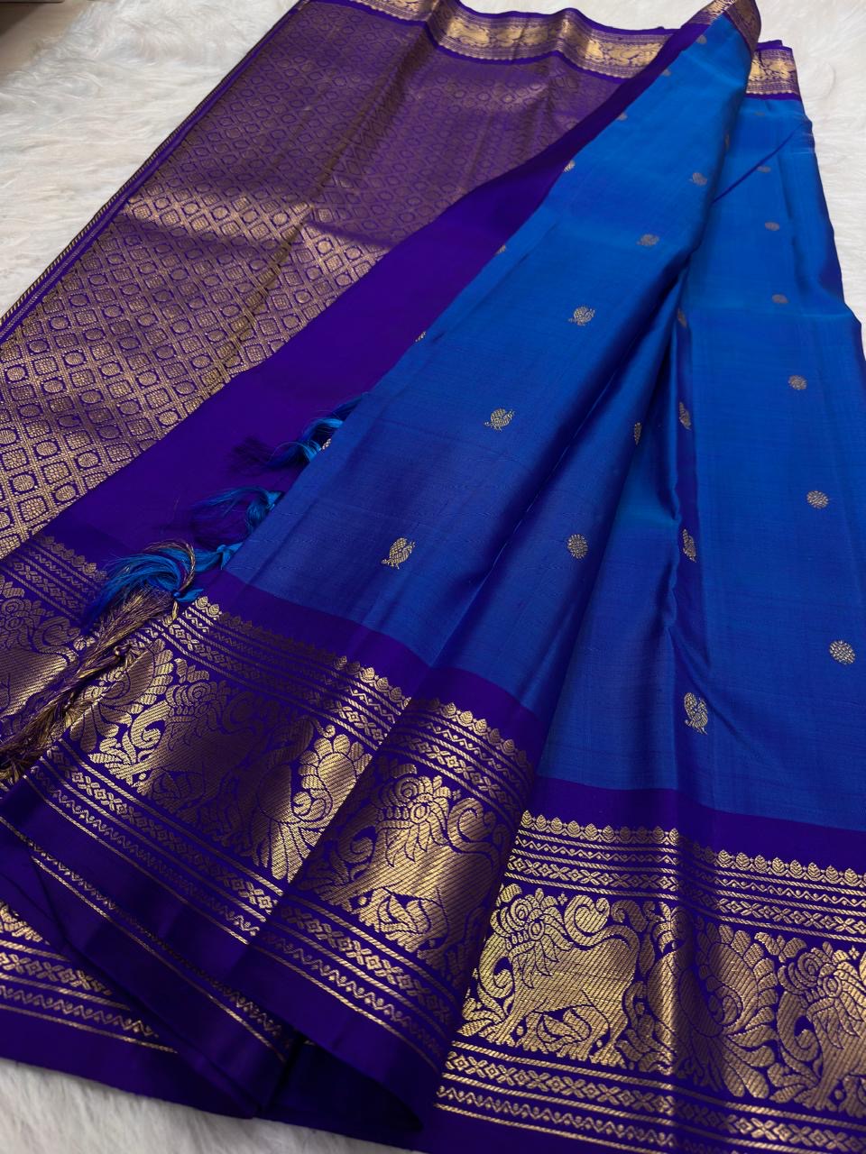 Deep Vadamalli Purple Kanchipuram border with dense classic-gold floral and scrolling zari ornament.