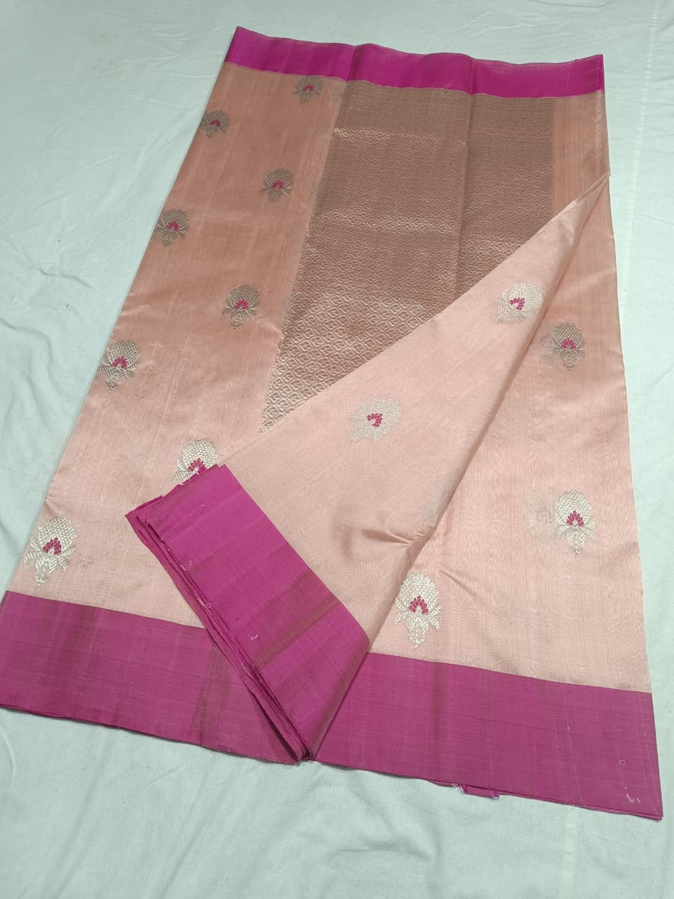 Blush Peach handloom Chanderi silk saree with silver floral buttas, Rani Pink border and geometric silver pallu