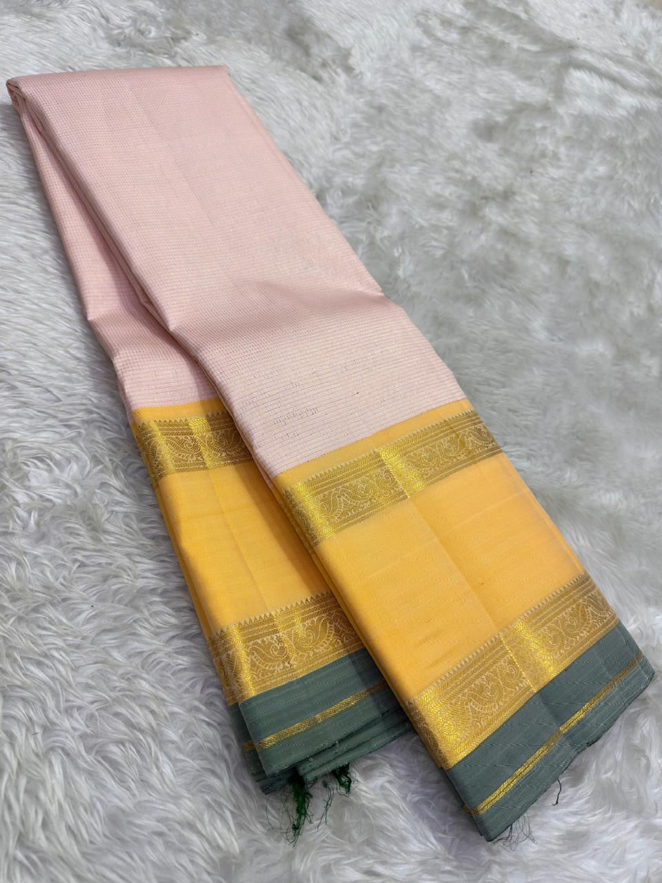 Kanchipattu silk saree in blush pink with butter yellow sage grey border border Korvai Rettapet weave traditional zari detail