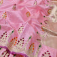 Close view of blush pink Pattu Silk Chanderi saree with gold motifs accented in magenta orange and green