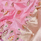 Blush pink Chanderi silk saree showing multicolour ornamental woven border and softly reflective striped pallu