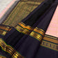 Deep Charcoal Kanjivaram border with antique gold zari and green accents