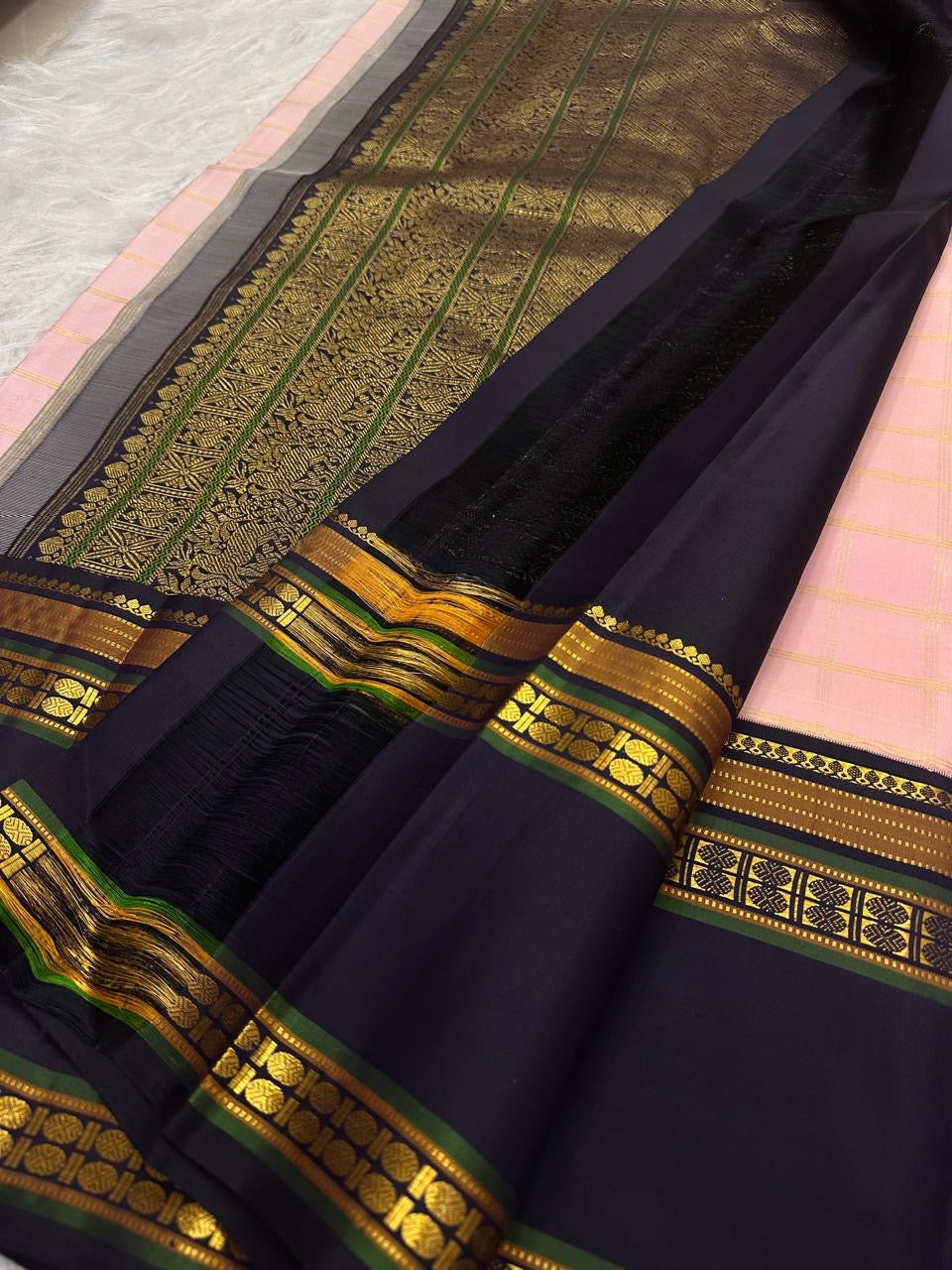 Deep Charcoal Kanjivaram border with antique gold zari and green accents