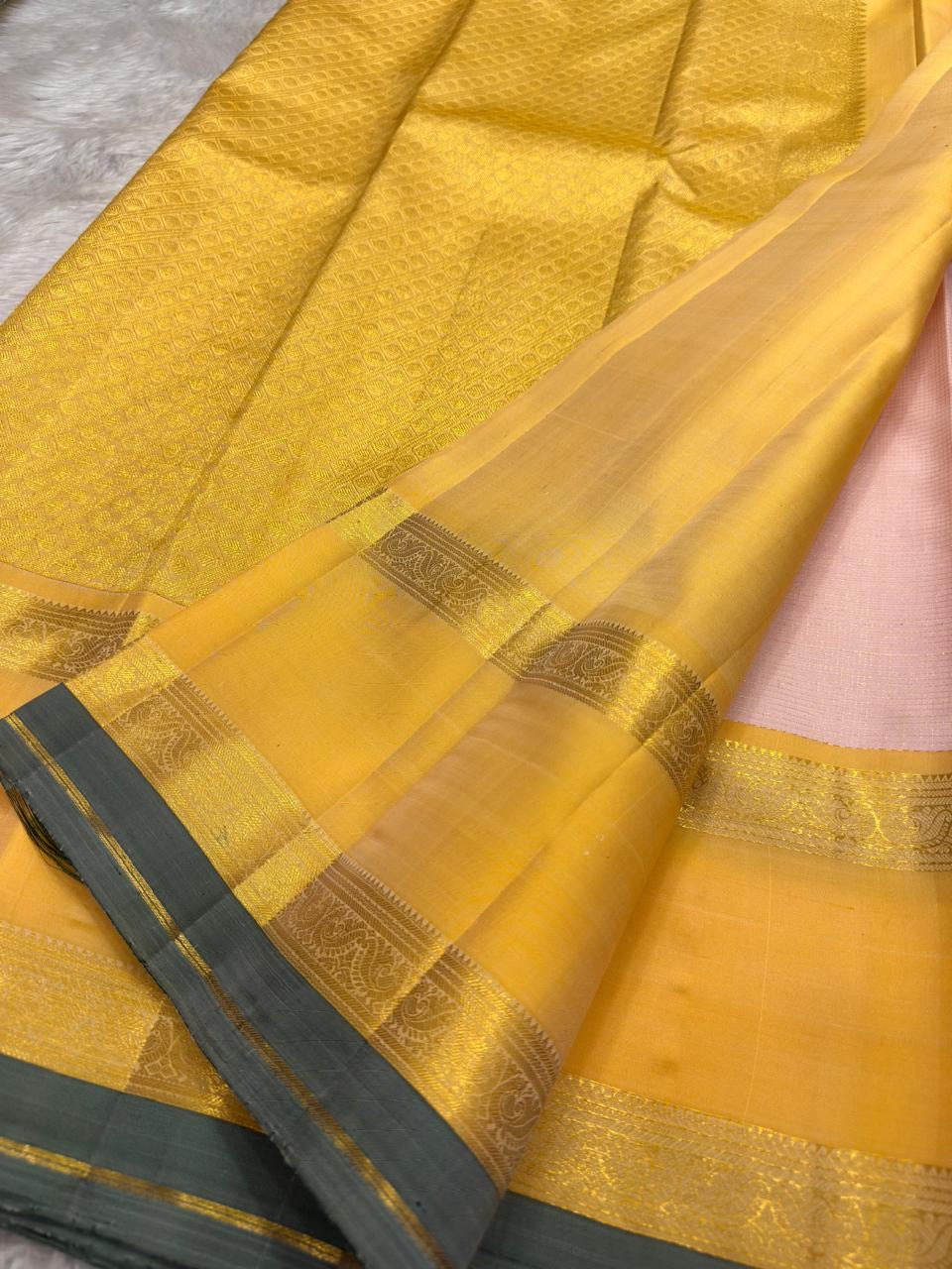 Close-up of Ganga Jamuna gold zari temple motif on blush pink Kanjeevaram silk saree — Idam Living