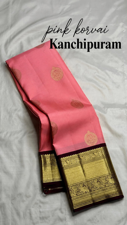 Blush pink handwoven pure silk Kanchi Pattu Korvai saree with mayil zari buttas and gold border, full view