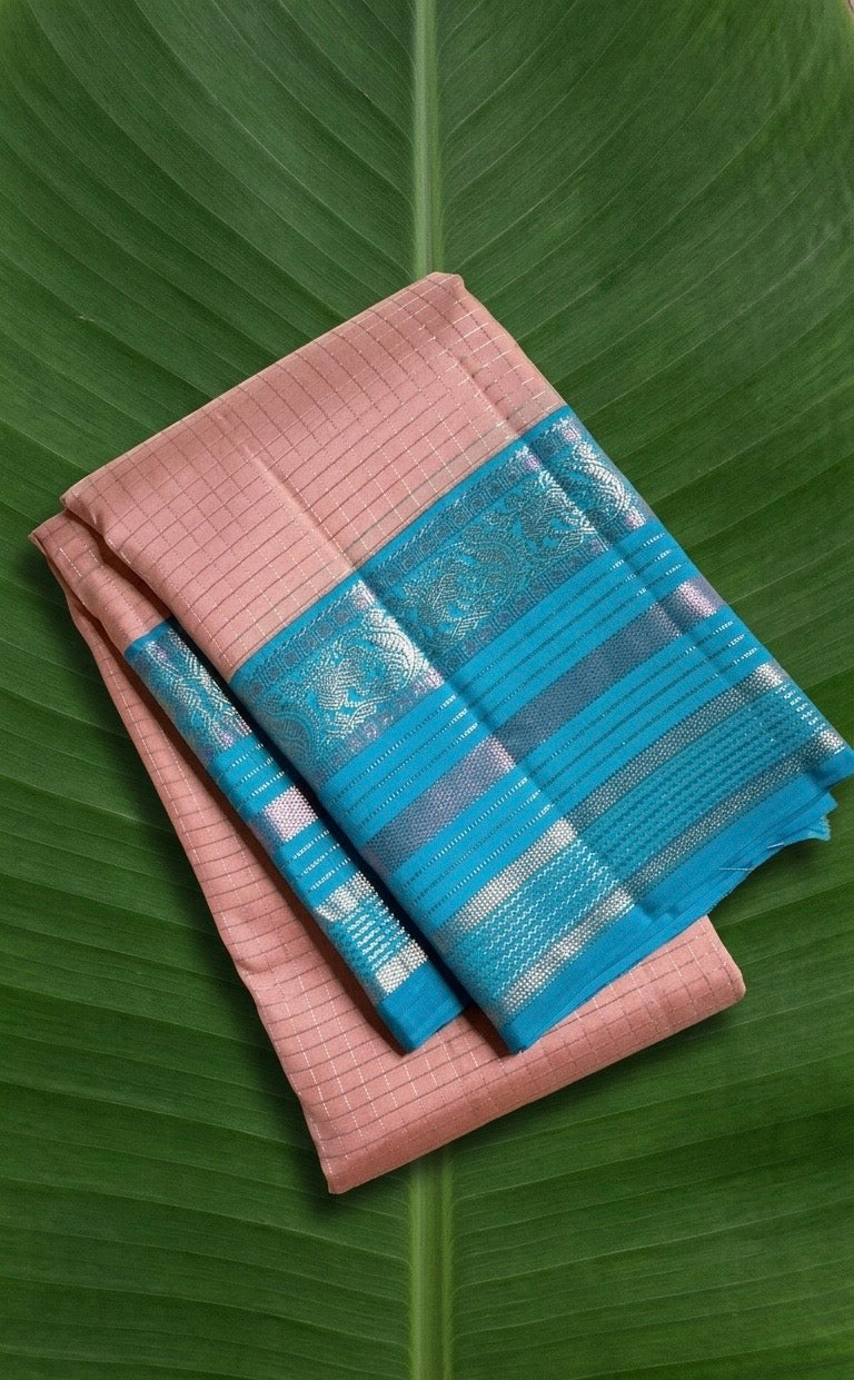 Kanchipattu silk saree in blush pink with turquoise blue border Zari Kattam weave traditional zari detail