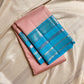 Kanchipattu silk saree in blush pink with turquoise blue border Zari Kattam weave traditional zari detail