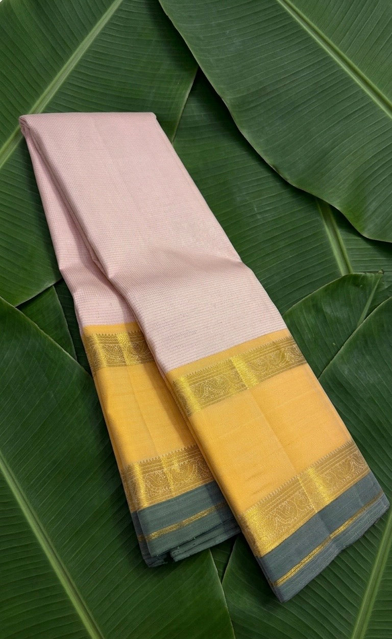 Blush pink handwoven Kanchipuram pure silk saree with vairaoosi weave and Ganga Jamuna border on banana leaf — Idam Living