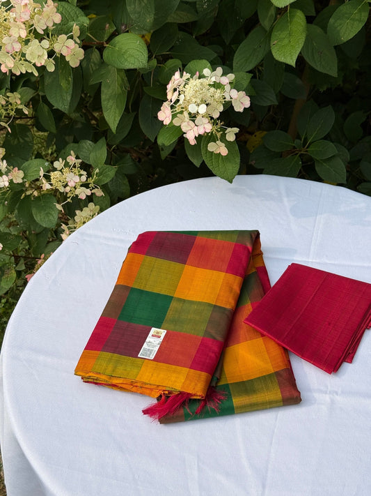 Pure Kanchipuram silk saree with multicolour kattam checks laid on white table