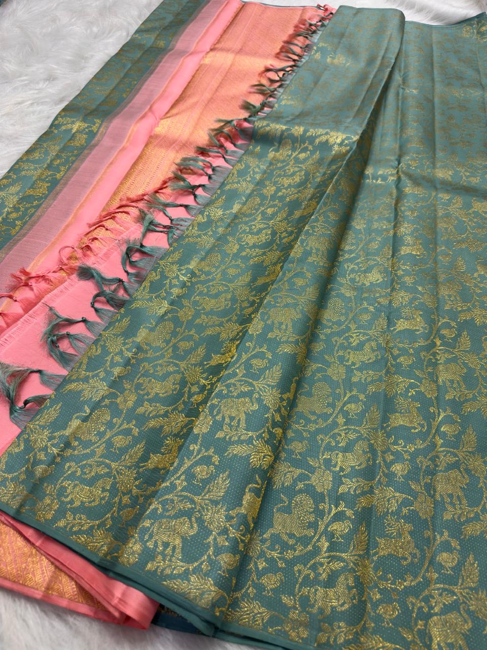All-over gold zari Vanasringaram motifs on aqua pure silk Kancheepuram saree